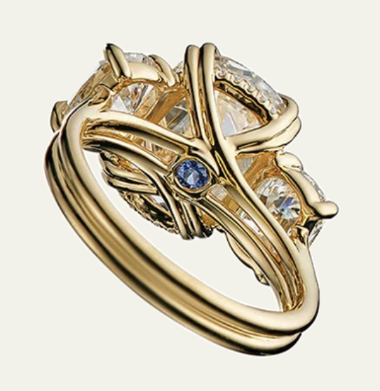 A picture of the Jean Dousset's "hidden stone" sky blue topaz placed under the center diamond for the eyes of the wearer only.