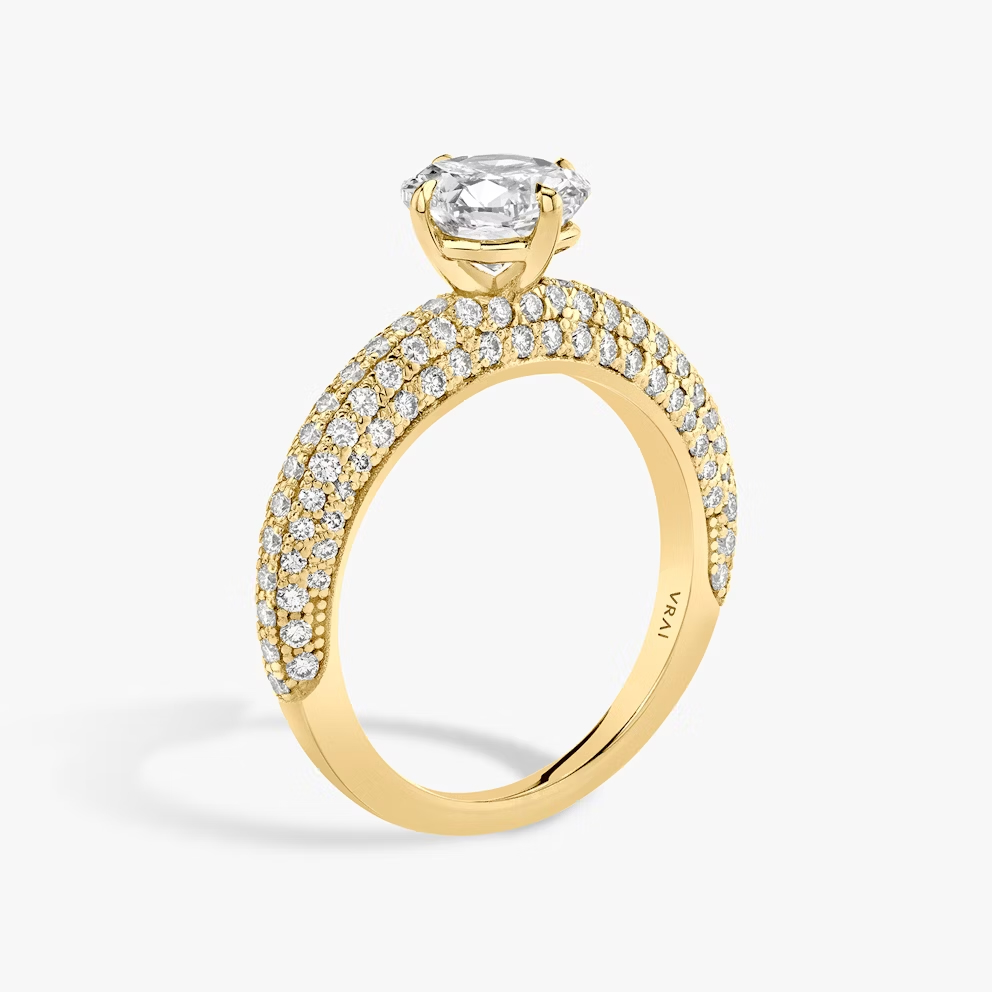 This is the Curator Cushion Engagement Ring in 18k yellow gold with a 1.5ct Cushion lab-grown diamond, pavé band, from Vrai.